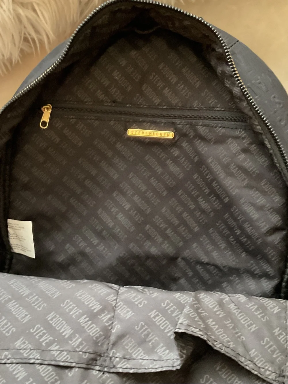 Steve Madden Black Embossed Logo Backpack with Gold Zipper